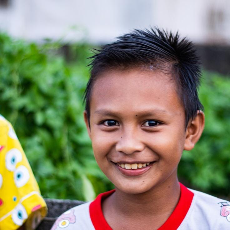 Kaveri Mehta, Lead Design Curator at Lively Verdant Folio, reviewing corporate floral arrangements
